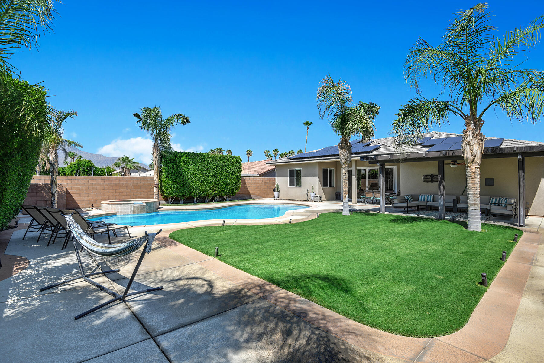 68965 Hermosillo Road Cathedral City, CA 92234 - Photo 26 of 40 a view of a chair and tables in the patio