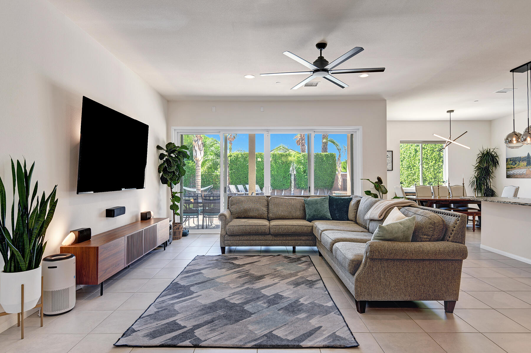 68965 Hermosillo Road Cathedral City, CA 92234 - Photo 3 of 40 a living room with furniture and a flat screen tv