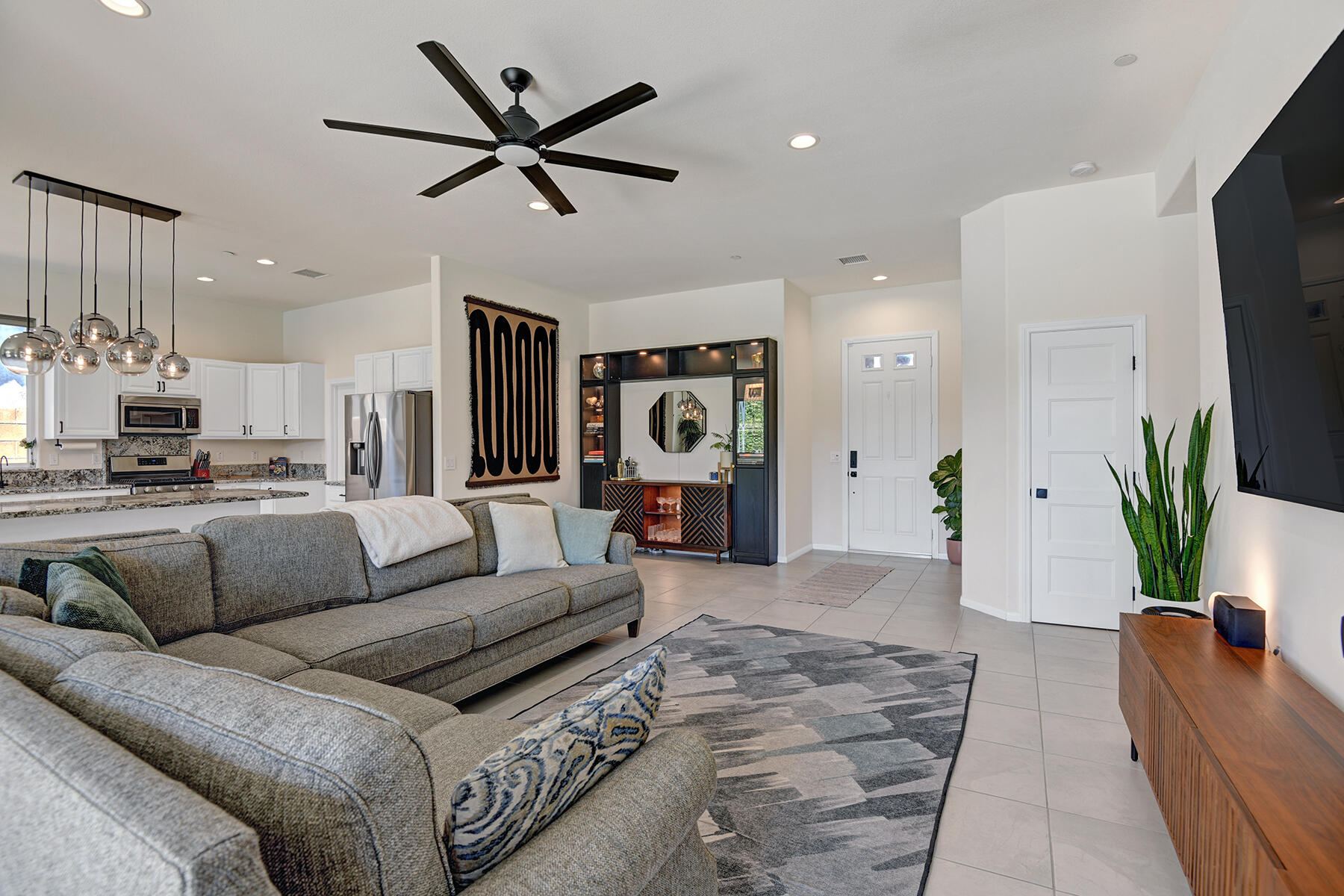 68965 Hermosillo Road Cathedral City, CA 92234 - Photo 9 of 40 a living room with furniture and a flat screen tv