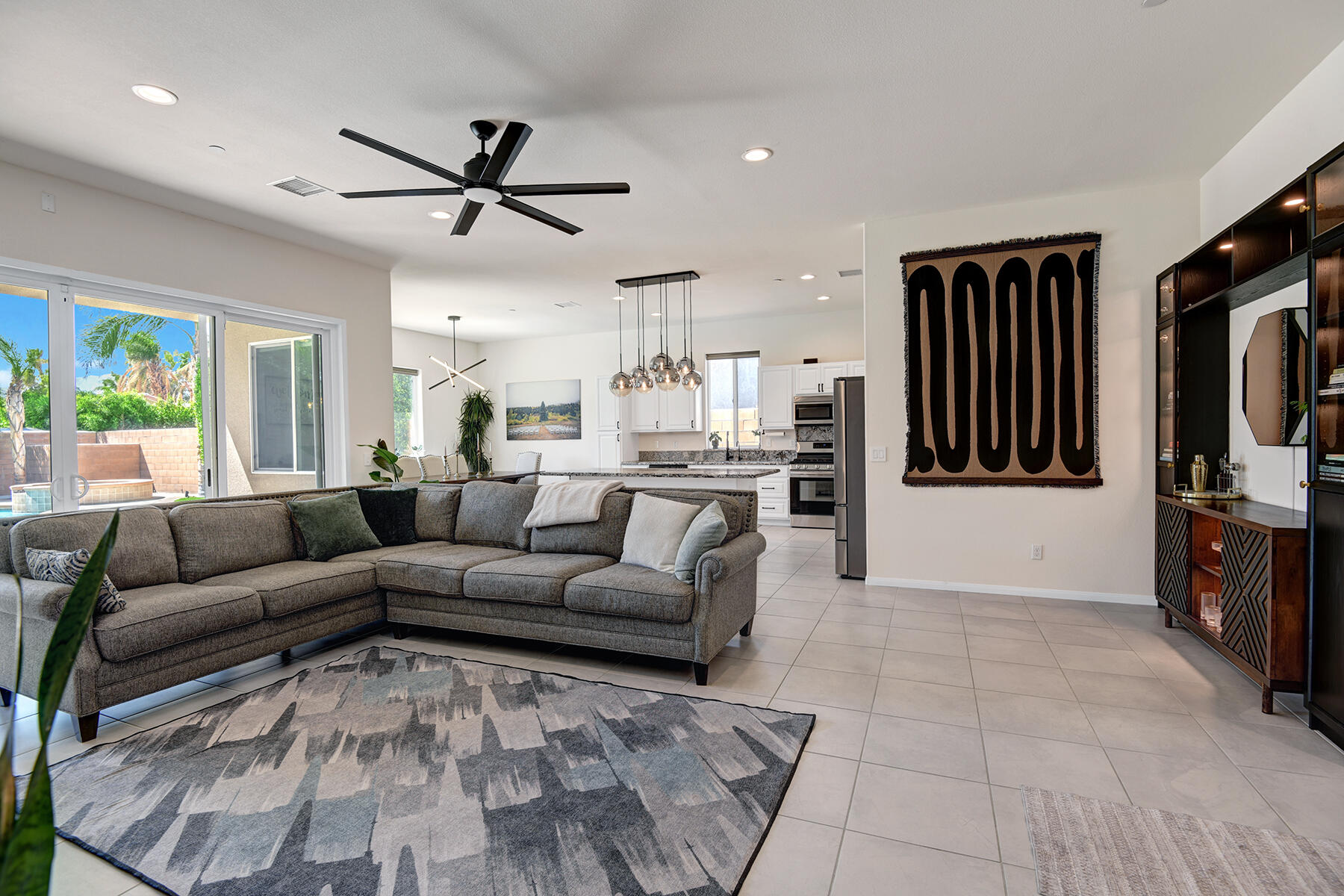 68965 Hermosillo Road Cathedral City, CA 92234 - Photo 10 of 40 a living room with furniture and a flat screen tv