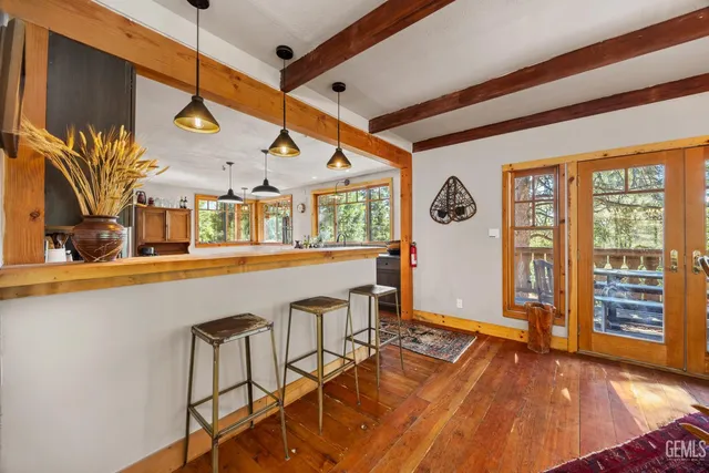 a view of a living room and entryway
