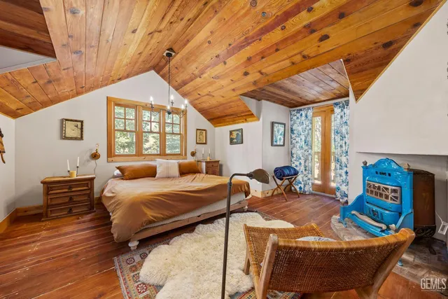 a bedroom with furniture and a window