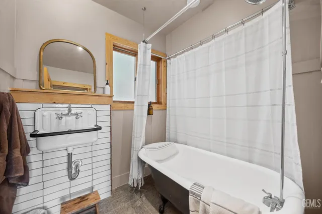 a bathroom with a sink a vanity and a mirror