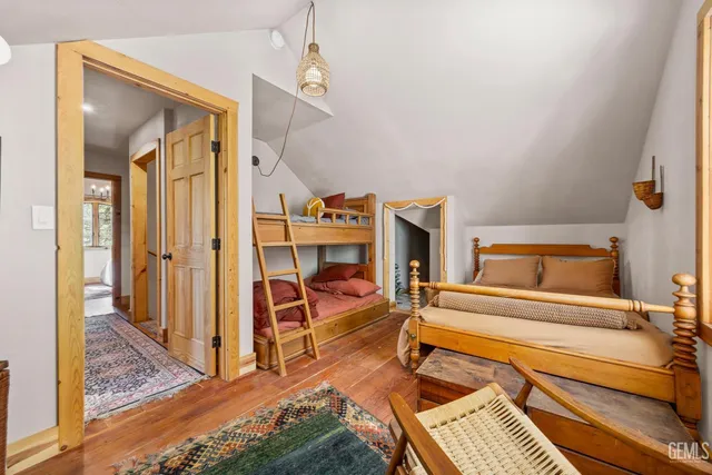 a bedroom with furniture and a rug