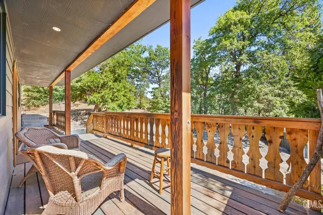 a view of a two chairs in the balcony