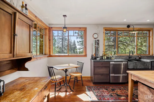 a view of a dining room with furniture window and outside view