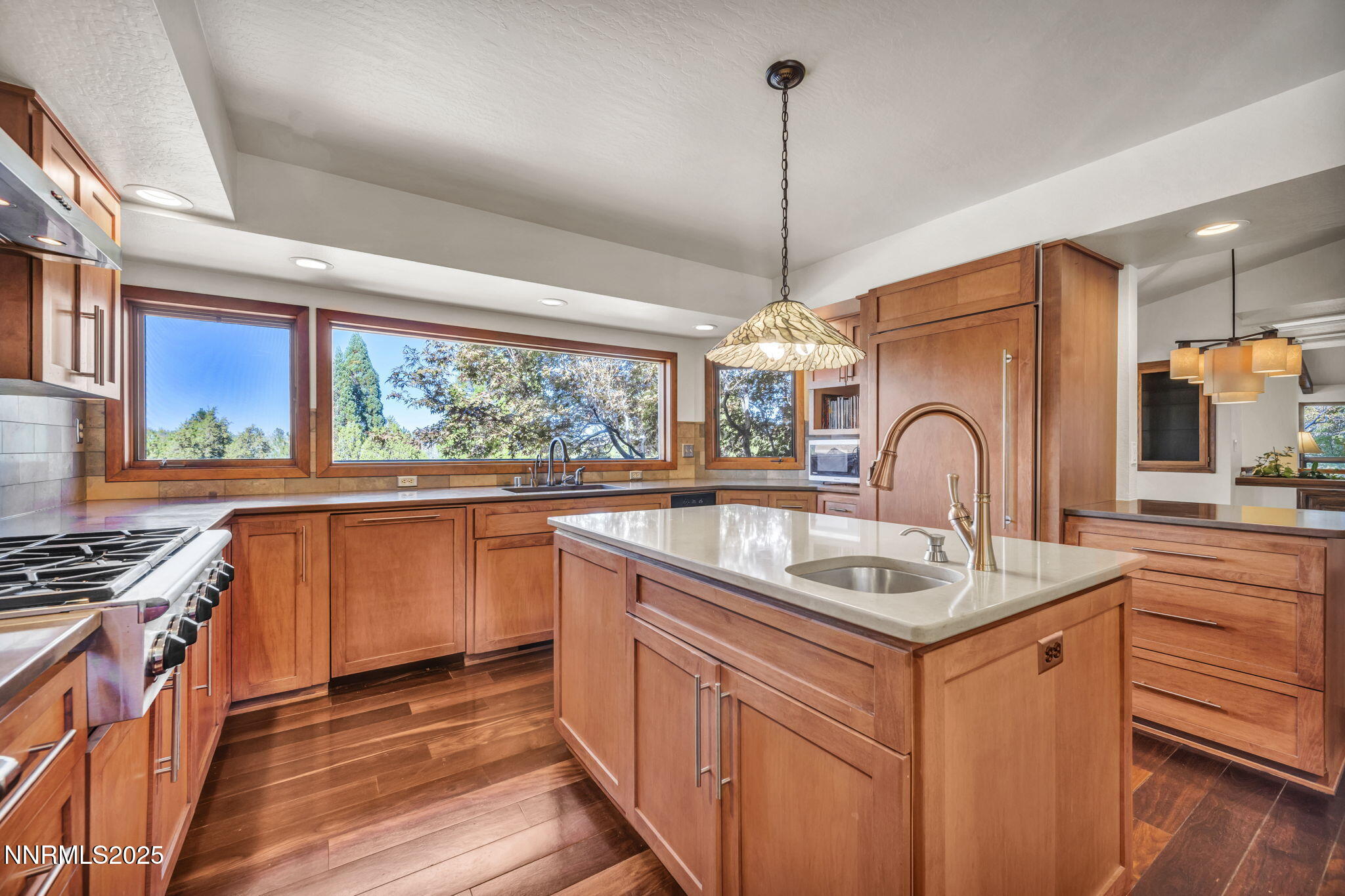 4283 Water Hole Road Reno, NV 89519 - Photo 13 of 62 a kitchen with stainless steel appliances granite countertop a sink stove and cabinets