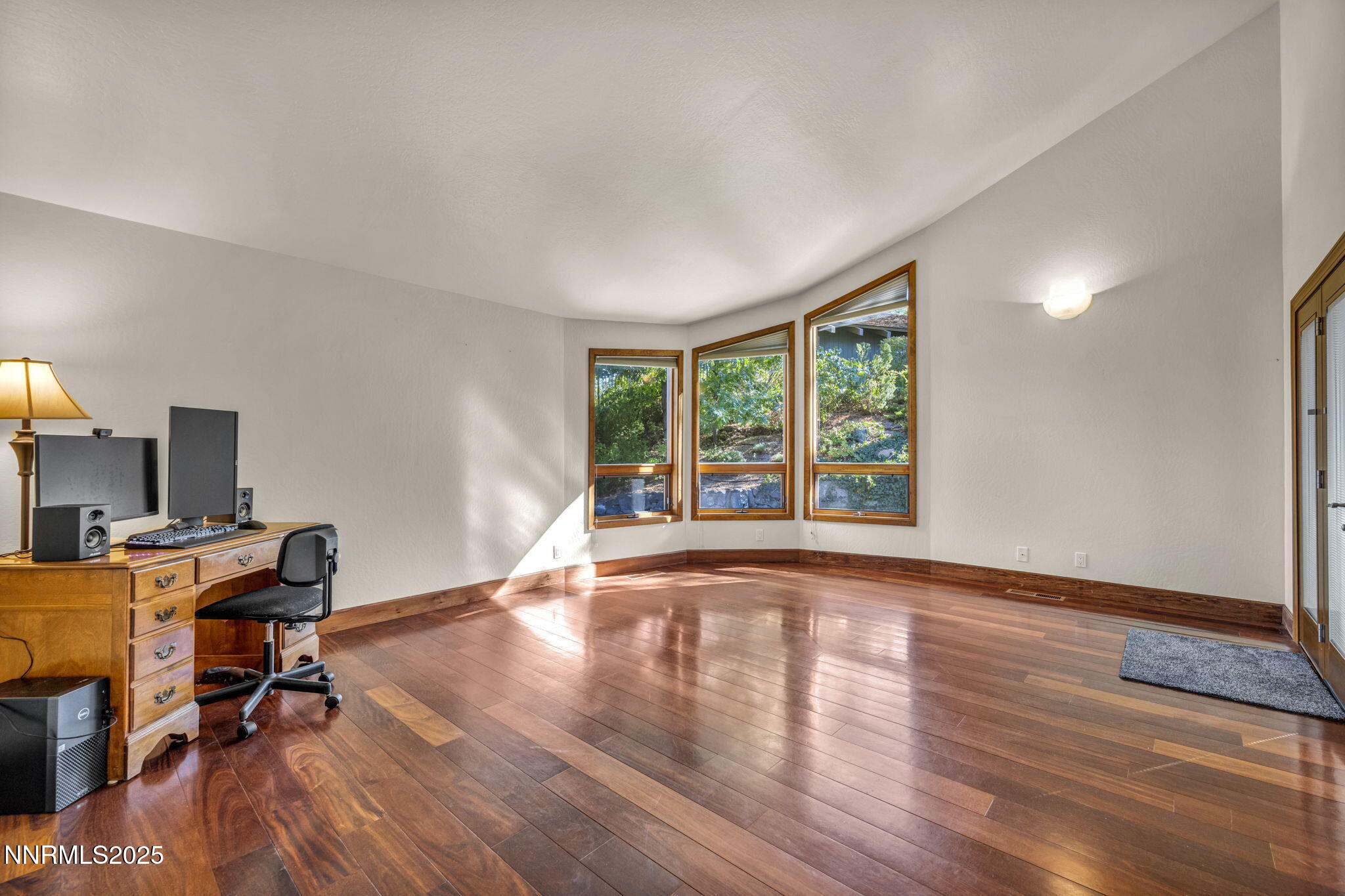 4283 Water Hole Road Reno, NV 89519 - Photo 26 of 62 a workspace with wooden floor and a window
