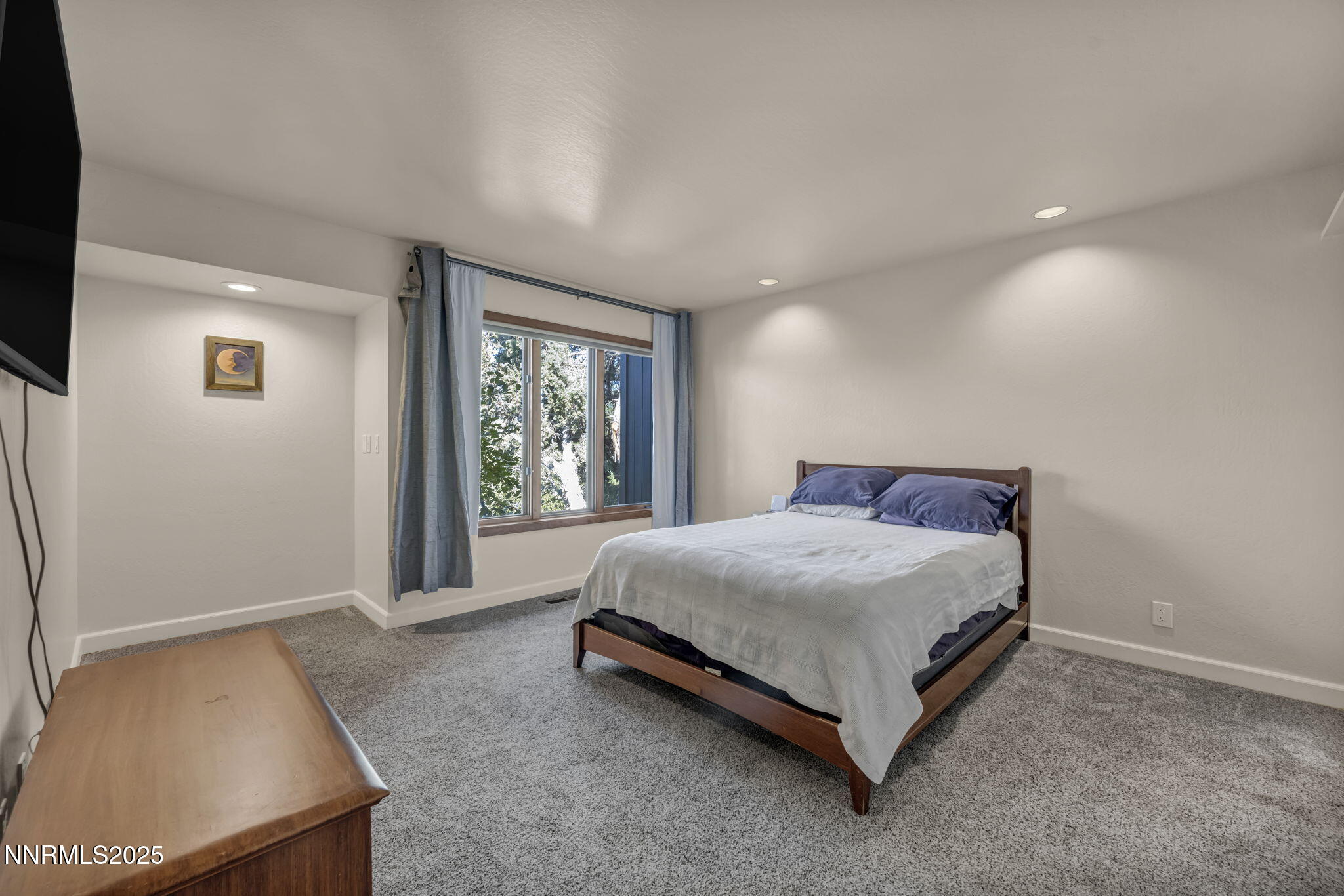 4283 Water Hole Road Reno, NV 89519 - Photo 33 of 62 a bedroom with a bed lamp and window