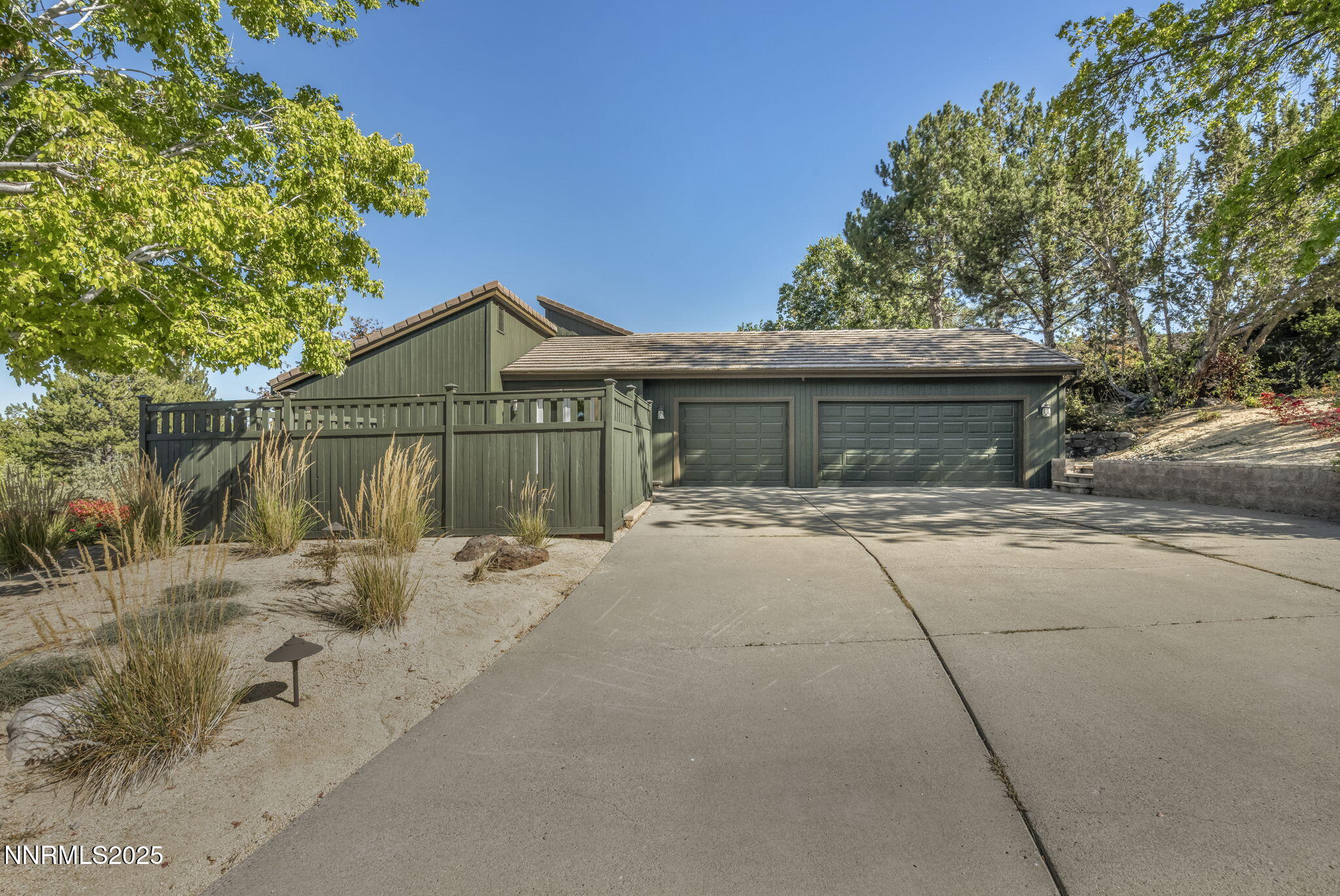 4283 Water Hole Road Reno, NV 89519 - Photo 47 of 62 a front view of a house with a wooden fence