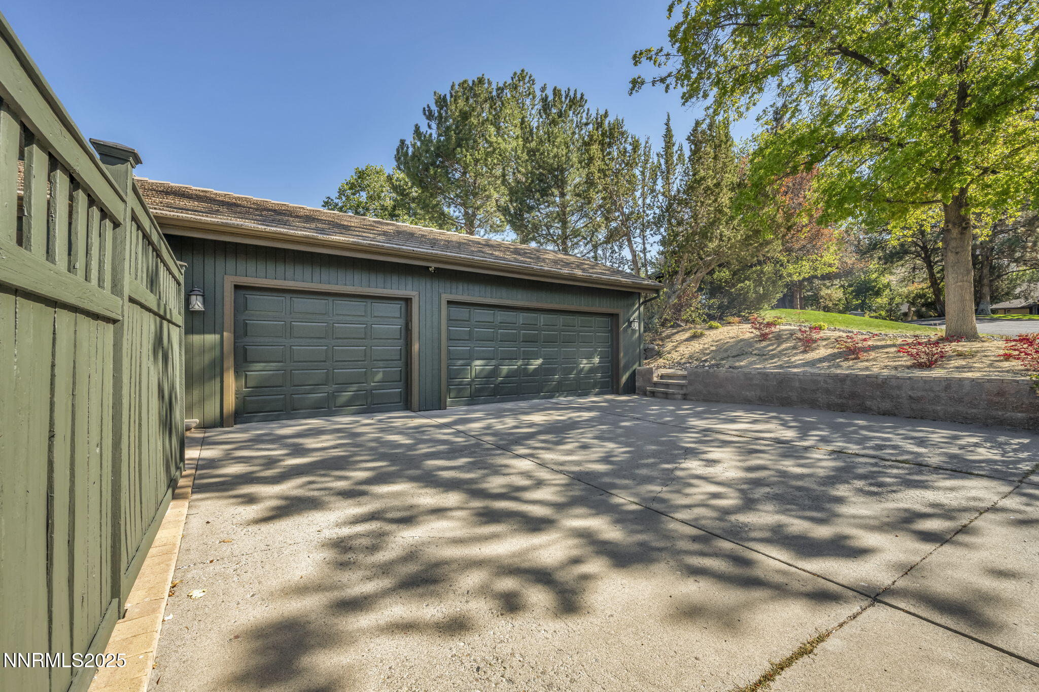 4283 Water Hole Road Reno, NV 89519 - Photo 48 of 62 a front view of a house with a yard and garage
