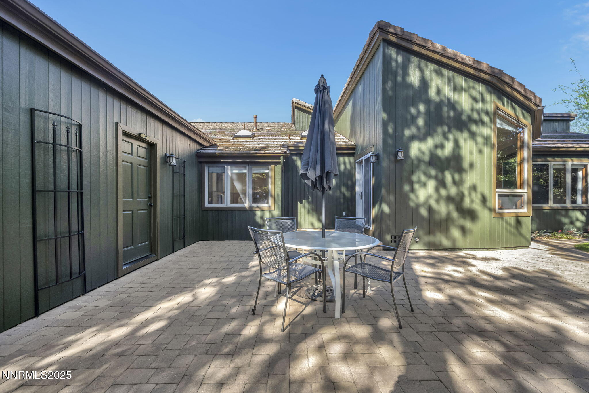4283 Water Hole Road Reno, NV 89519 - Photo 51 of 62 a patio with table and chairs and potted plants