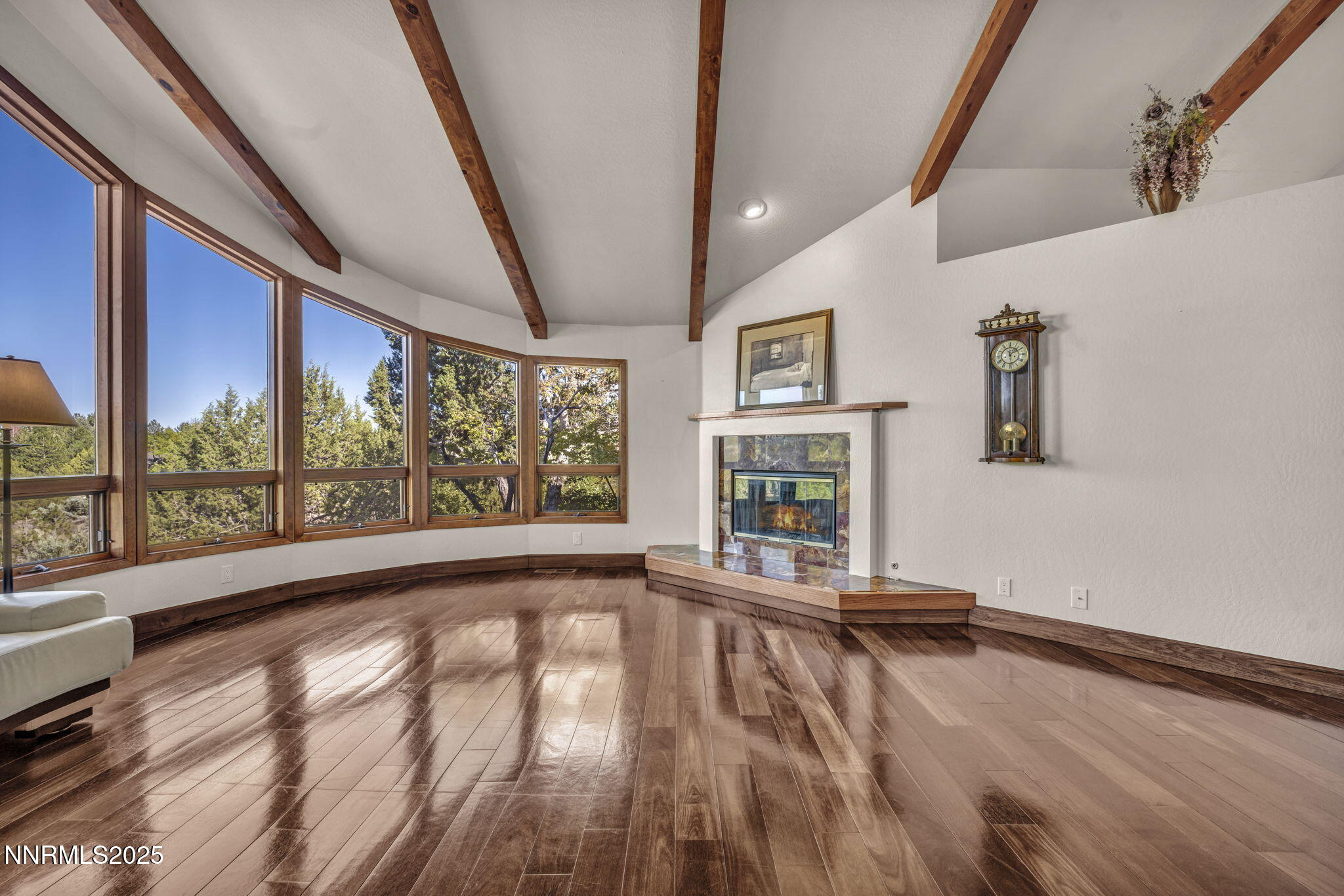 4283 Water Hole Road Reno, NV 89519 - Photo 8 of 62 a view of an empty room with a window and wooden floor