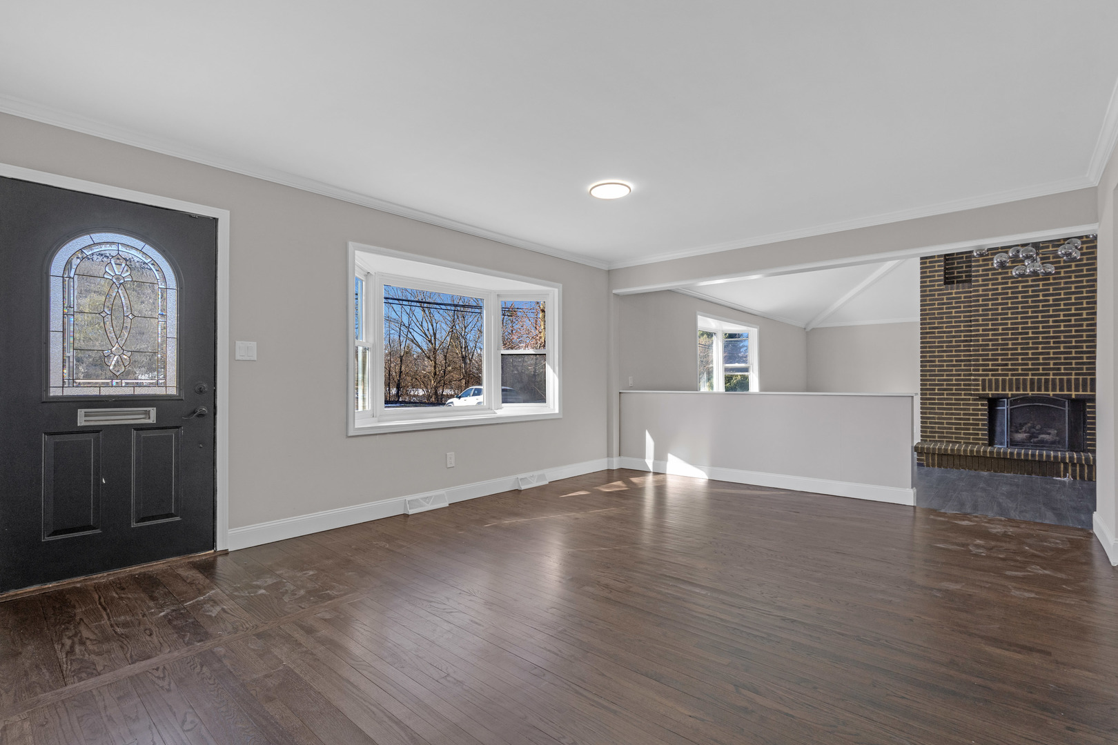 160 Marley Road New Lenox, IL 60451 - Photo 3 of 23 a view of an empty room with window and wooden floor