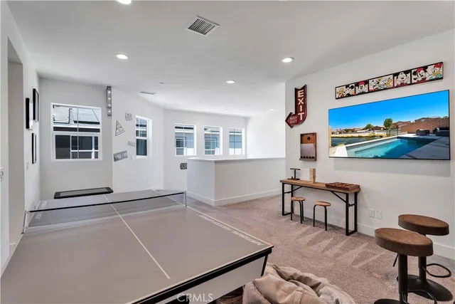 a living room with furniture a dining table and chairs with kitchen view