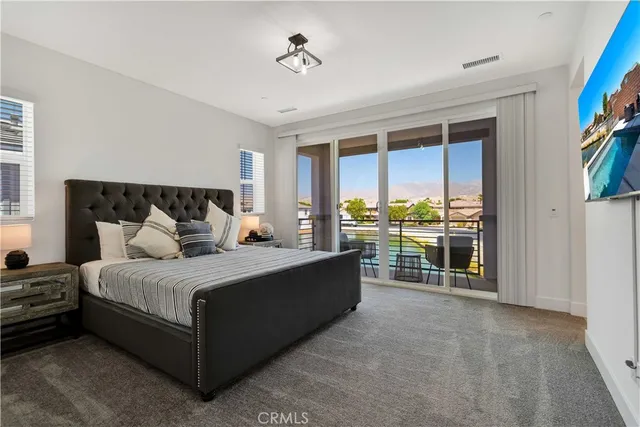 a bed room with a bed and a large window