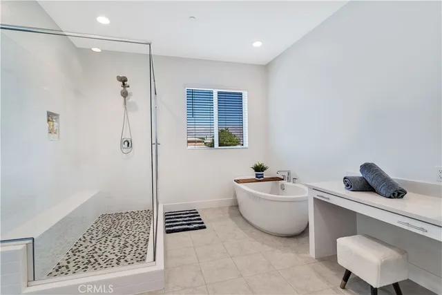 a bathroom with a bathtub a sink and a shower