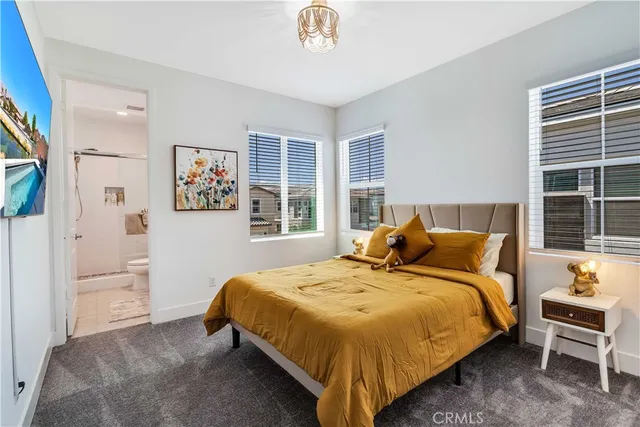 a bedroom with a bed and a table