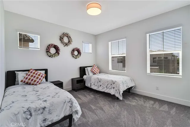 a bedroom with bed and a window