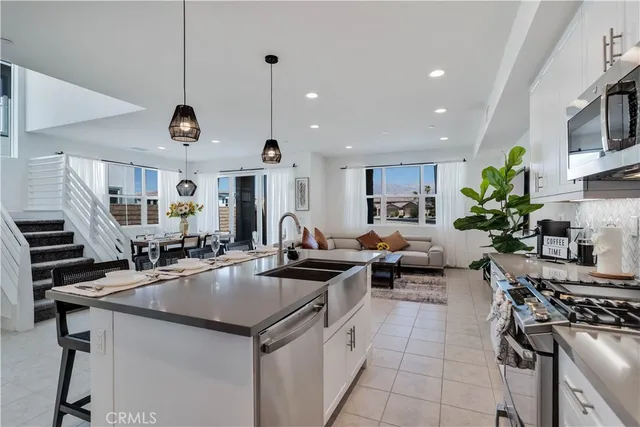 a kitchen with counter top appliances and cabinets
