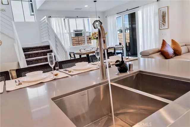 a kitchen with a sink and a refrigerator