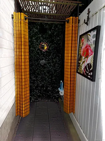 a view of walk in closet with clothes