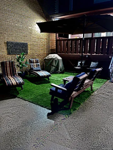 a view of a backyard with sitting area