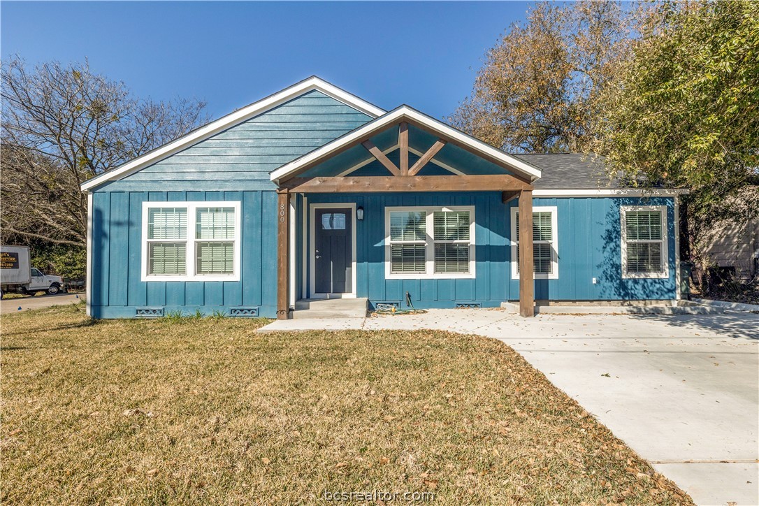 800 Oak Street Bryan, TX 77802 - Photo 1 of 1 a front view of a house with a yard and garage
