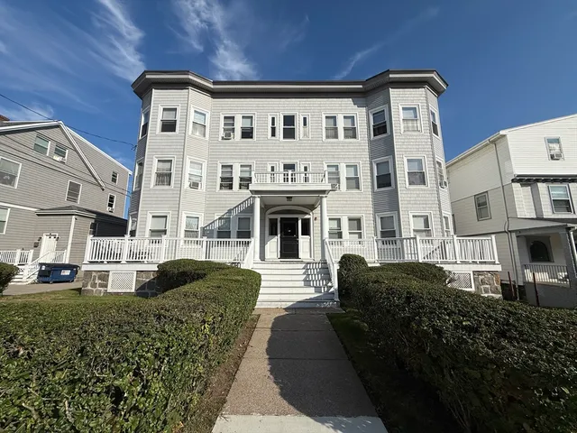 a front view of a building with multiple windows