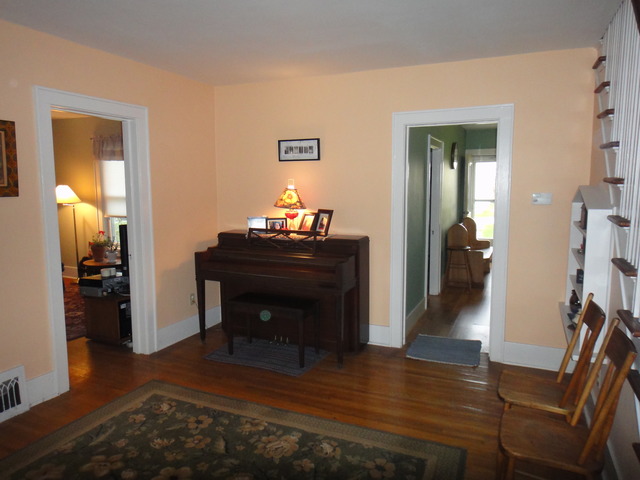 13592 Waterman Road Waterman, IL 60556 - Photo 8 of 22 a room with furniture and a wooden floor