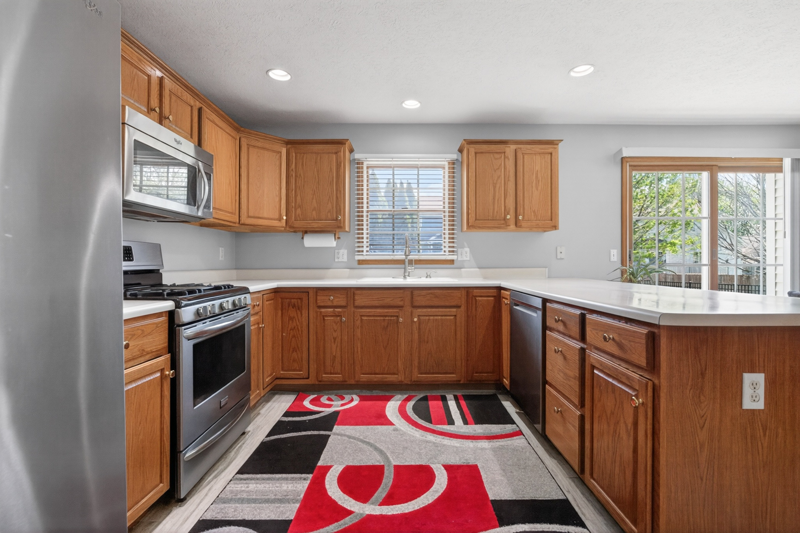 1503 Broad Creek Road Bloomington, IL 61704 - Photo 12 of 31 a kitchen with a sink stove and cabinets