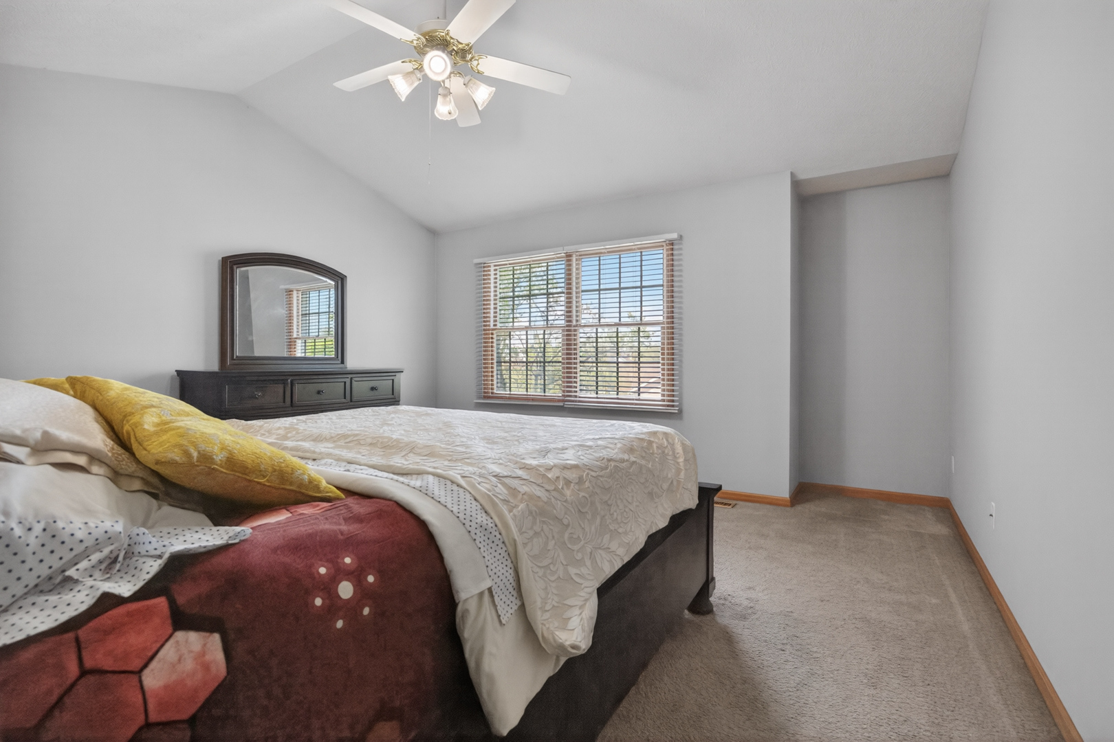 1503 Broad Creek Road Bloomington, IL 61704 - Photo 16 of 31 a bedroom with a bed and a chandelier