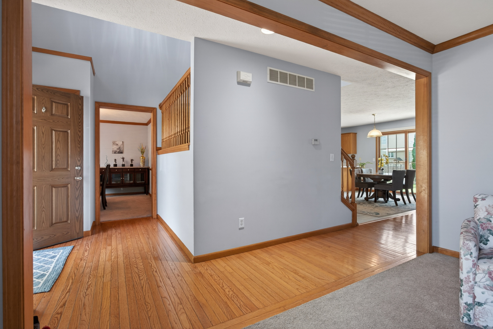 1503 Broad Creek Road Bloomington, IL 61704 - Photo 2 of 31 a view of a hallway view with wooden floor and a living room