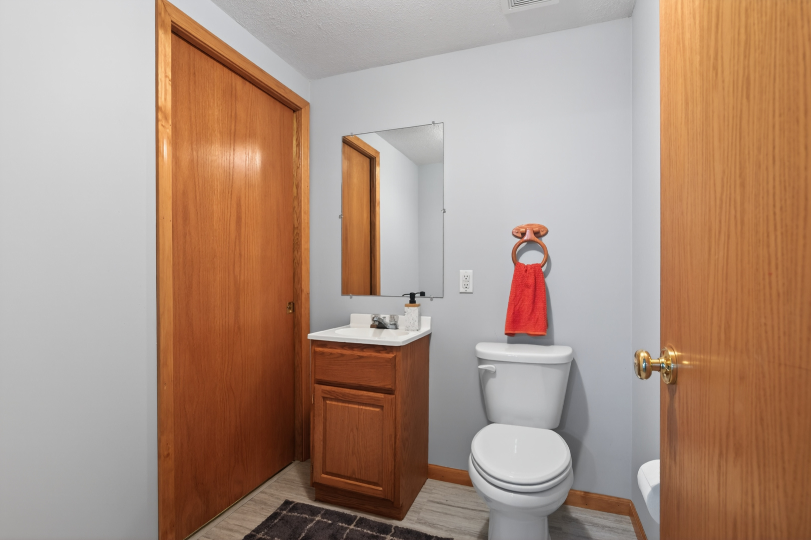 1503 Broad Creek Road Bloomington, IL 61704 - Photo 26 of 31 a bathroom with a toilet a sink and a mirror