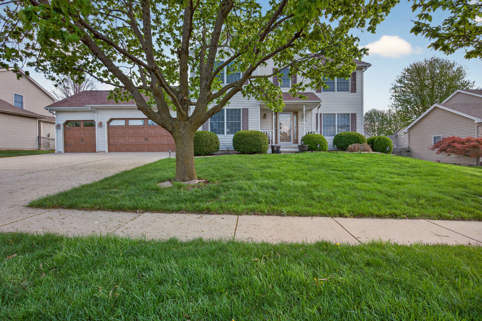 1503 Broad Creek Road Bloomington, IL 61704 - Photo 30 of 31 a front view of a house with a yard and trees