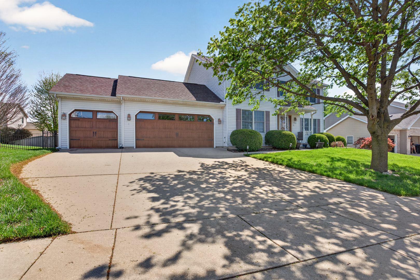 1503 Broad Creek Road Bloomington, IL 61704 - Photo 31 of 31 a front view of a house with a yard and garage