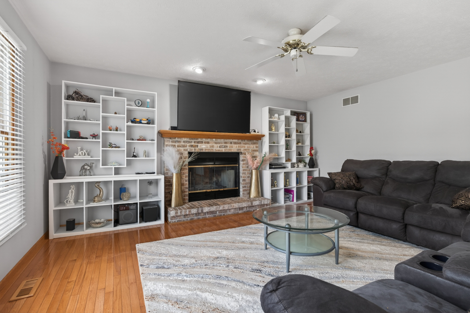 1503 Broad Creek Road Bloomington, IL 61704 - Photo 6 of 31 a living room with furniture fireplace and flat screen tv