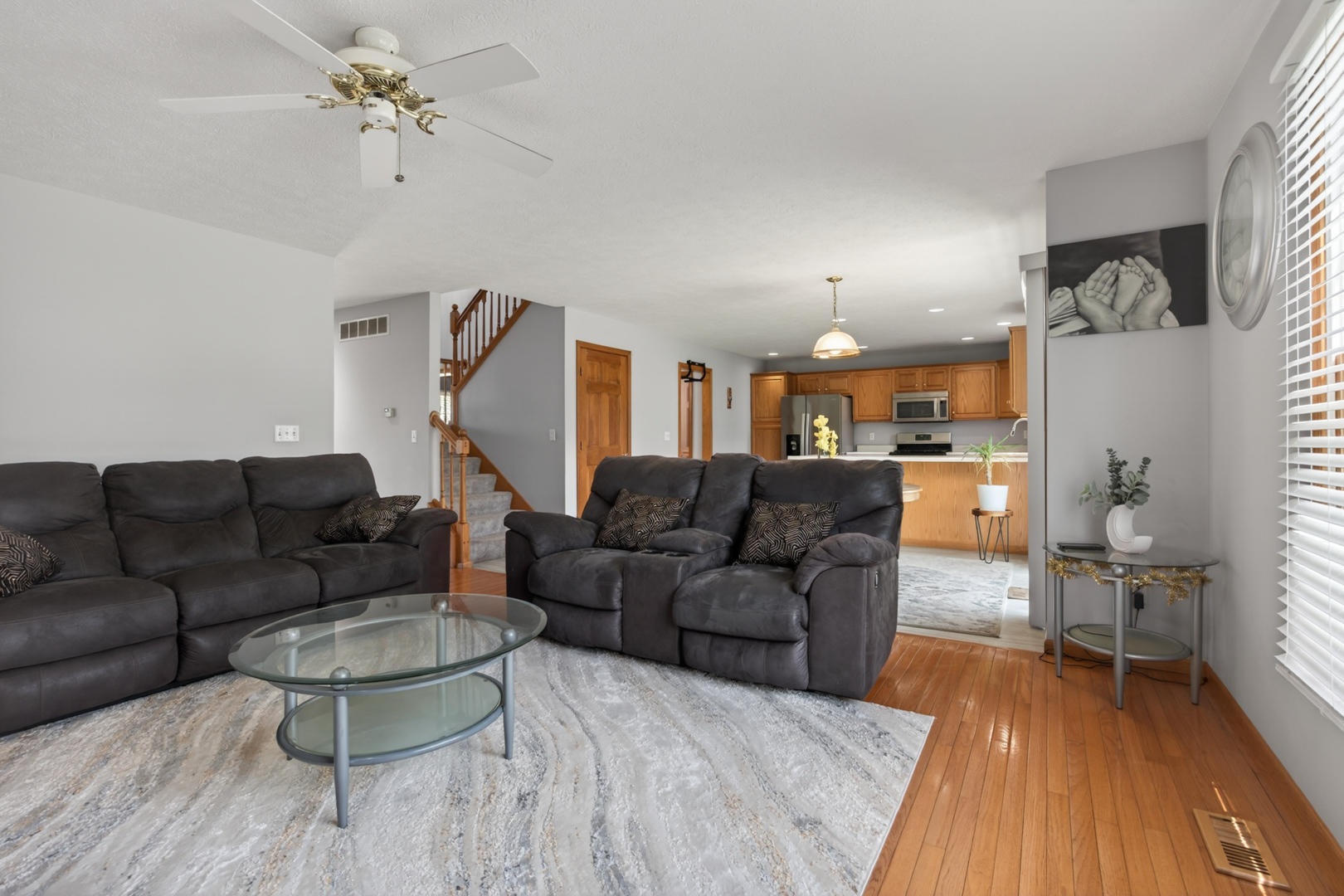 1503 Broad Creek Road Bloomington, IL 61704 - Photo 7 of 31 a living room with furniture and a wooden floor