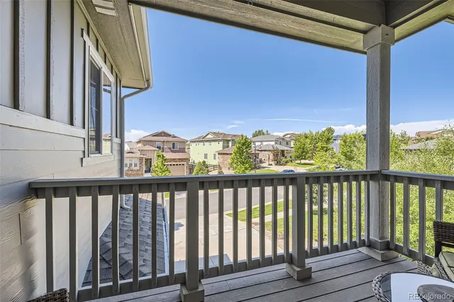 a view of a patio with table and chairs and potted plants