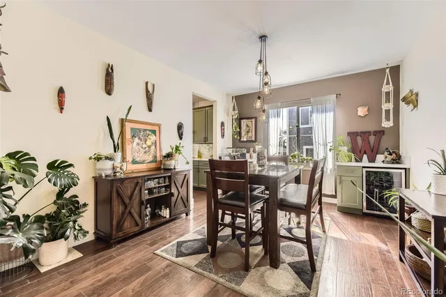 a view of a dining room with furniture and chandelier