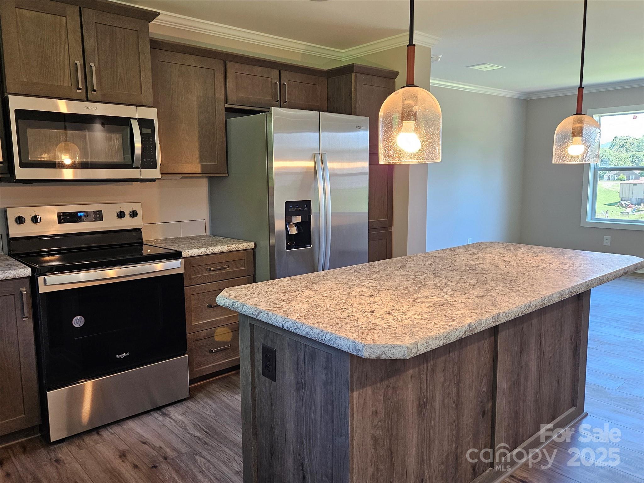784 Severt Circle Lenoir, NC 28645 - Photo 12 of 41 a kitchen with stainless steel appliances granite countertop a stove a refrigerator and a microwave