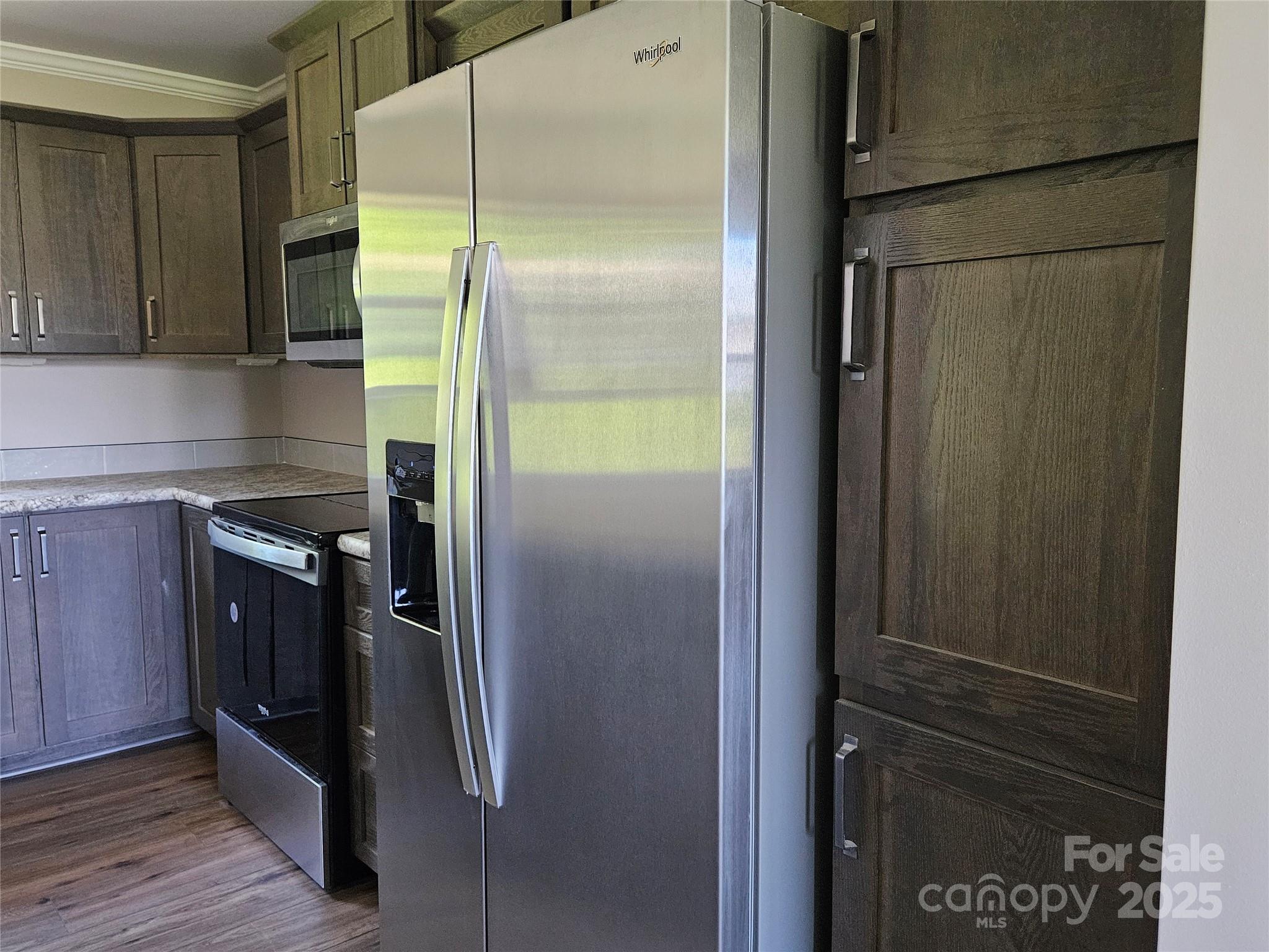 784 Severt Circle Lenoir, NC 28645 - Photo 13 of 41 a kitchen with metallic refrigerator freezer and a dishwasher