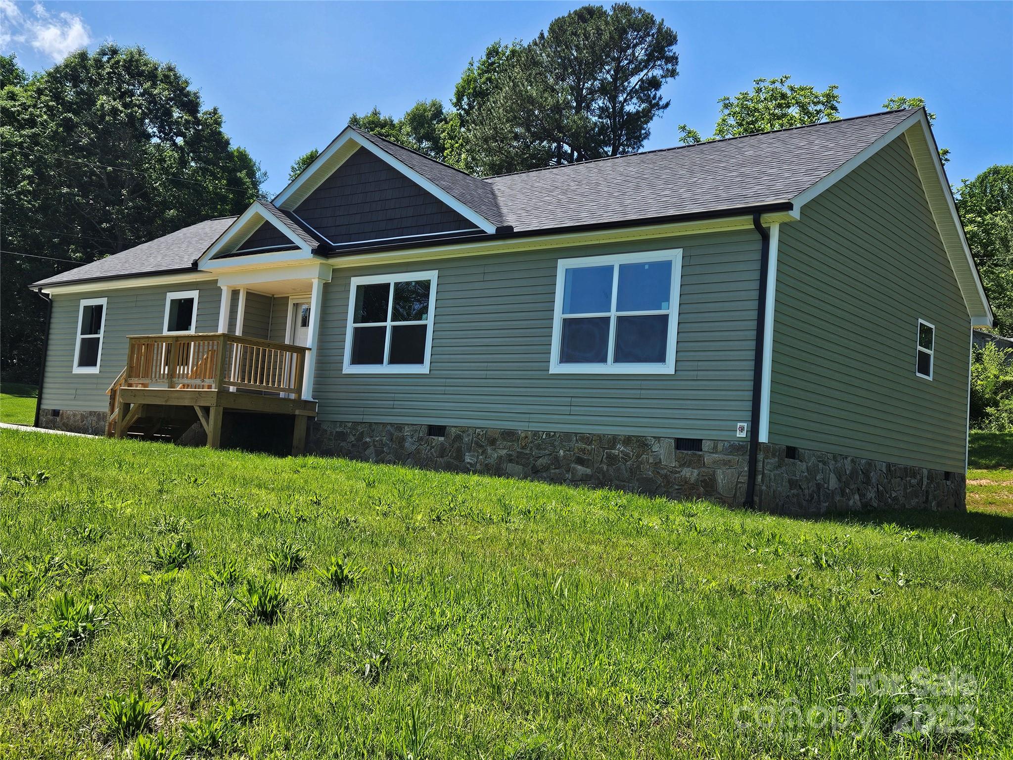 784 Severt Circle Lenoir, NC 28645 - Photo 2 of 41 a front view of a house with a garden