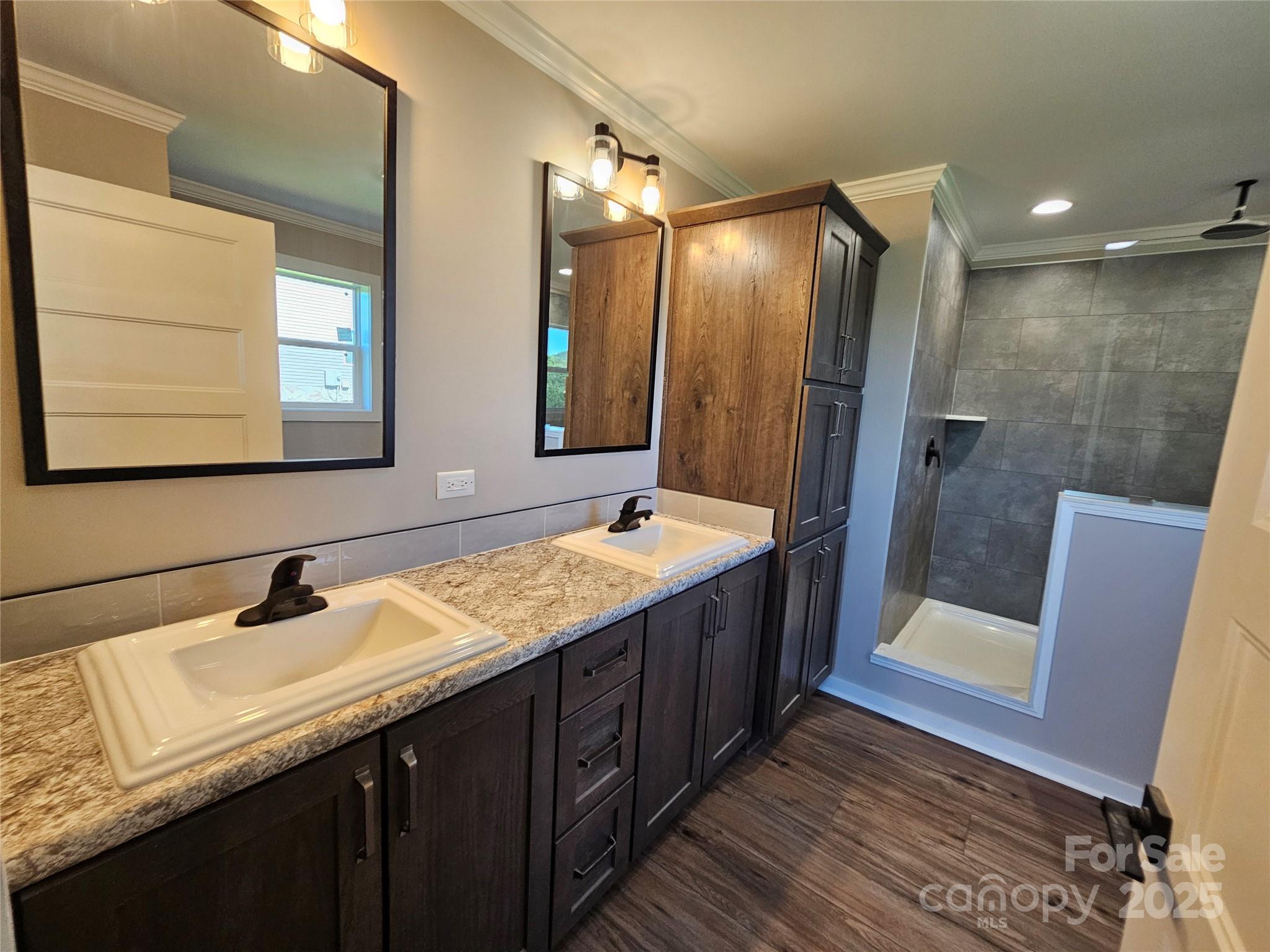 784 Severt Circle Lenoir, NC 28645 - Photo 27 of 41 a bathroom with a double vanity sink mirror and shower