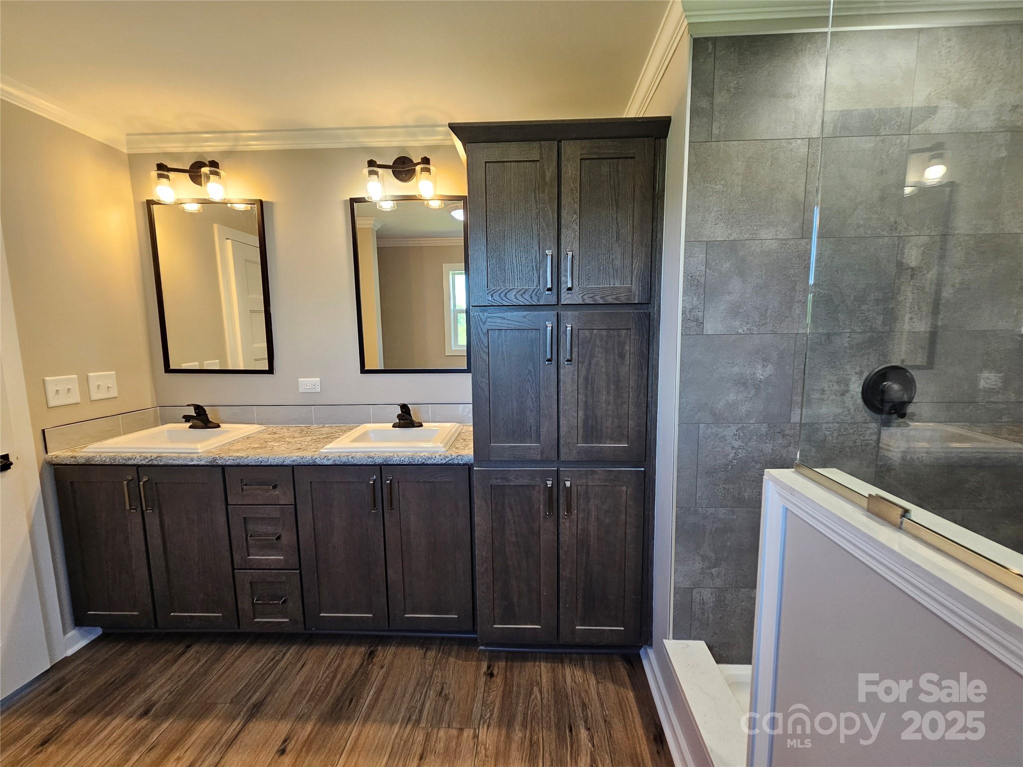 784 Severt Circle Lenoir, NC 28645 - Photo 28 of 41 a bathroom with a sink a mirror and shower