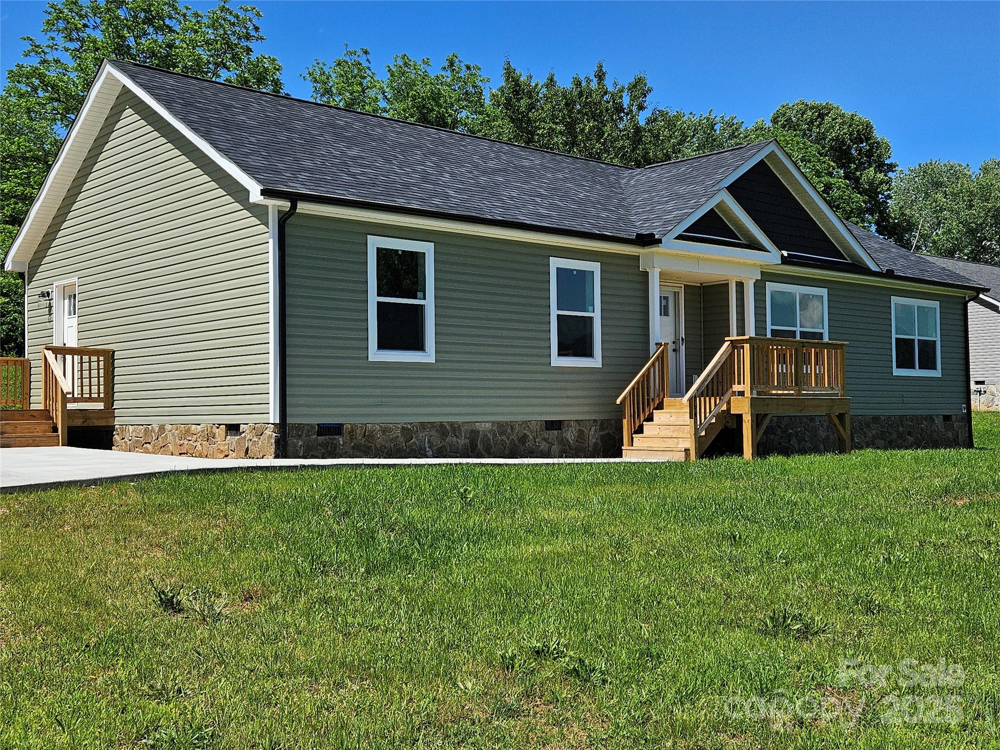 784 Severt Circle Lenoir, NC 28645 - Photo 3 of 41 a view of a house with a yard
