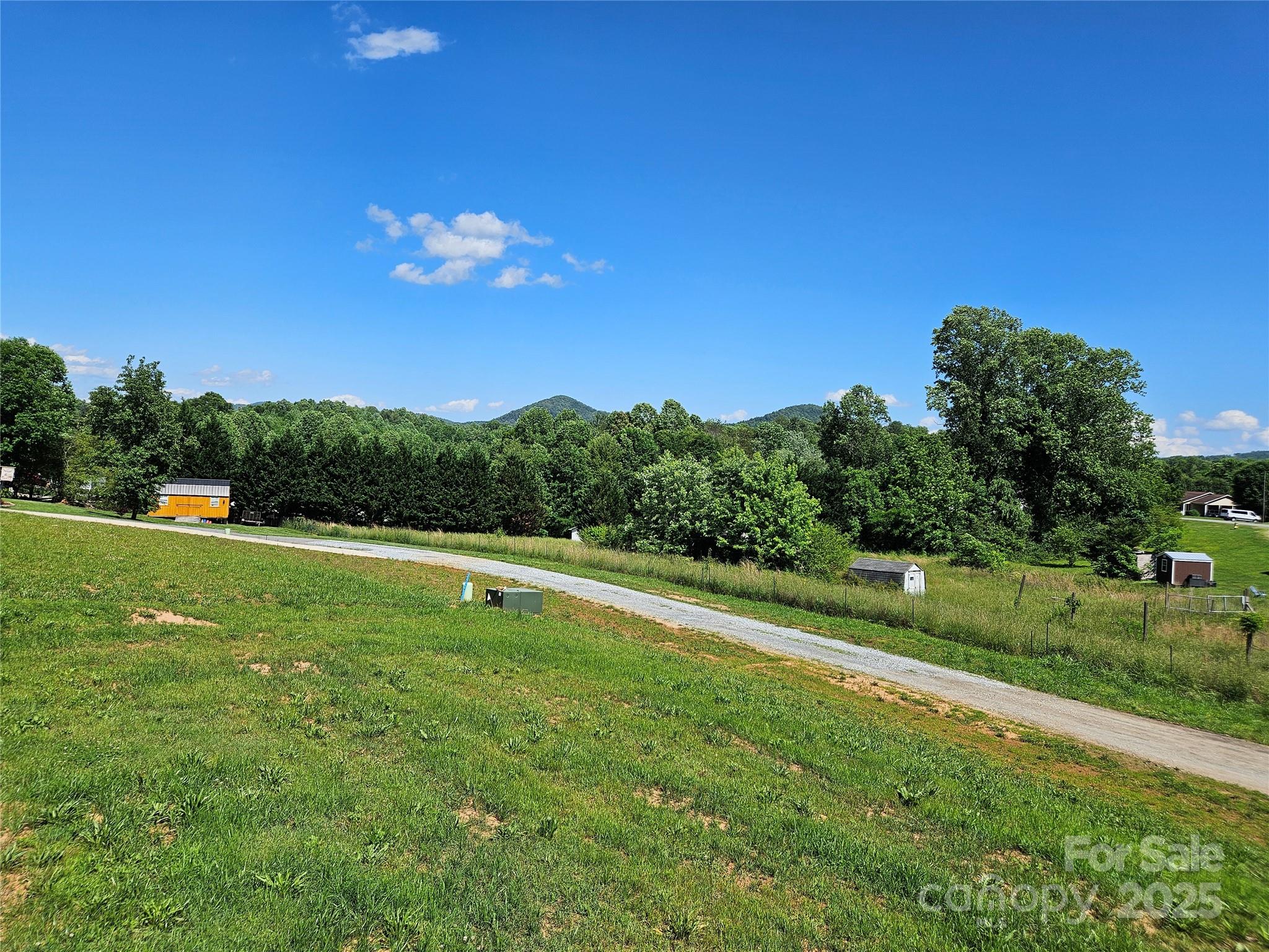 784 Severt Circle Lenoir, NC 28645 - Photo 31 of 41 a view of a golf course with a lake