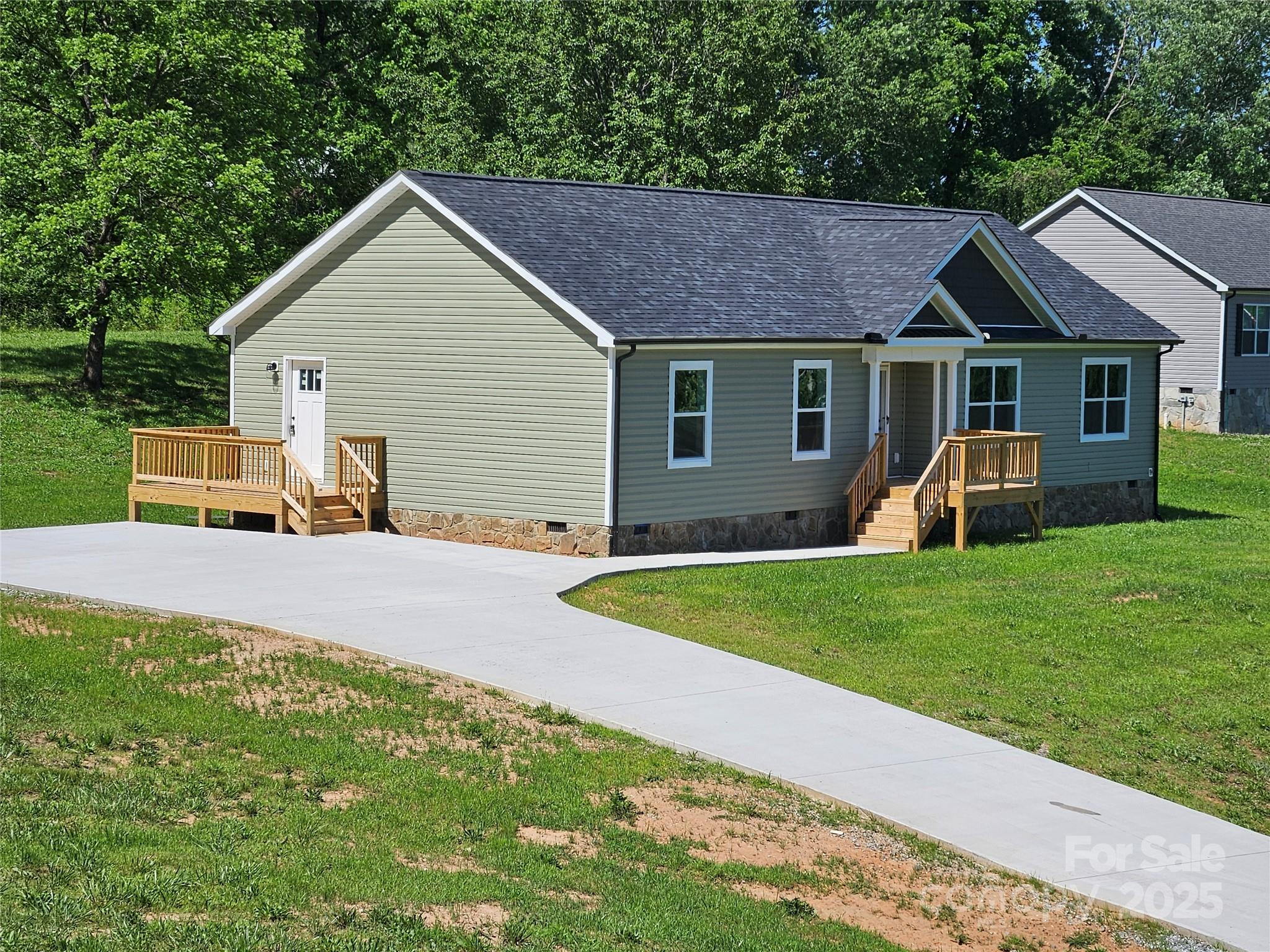 784 Severt Circle Lenoir, NC 28645 - Photo 6 of 41 a view of an house with backyard space and garden