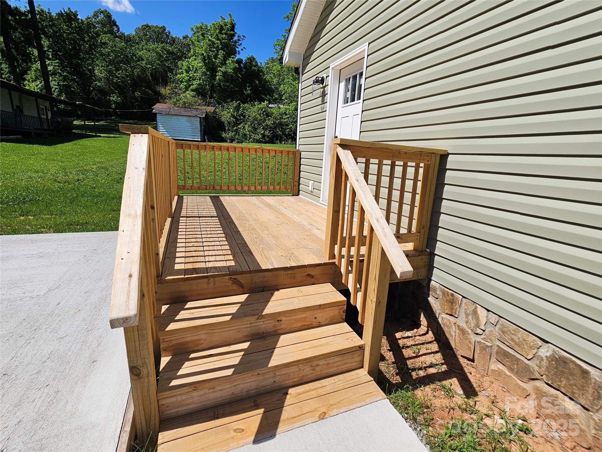 784 Severt Circle Lenoir, NC 28645 - Photo 7 of 41 a view of deck with chairs and wooden floor