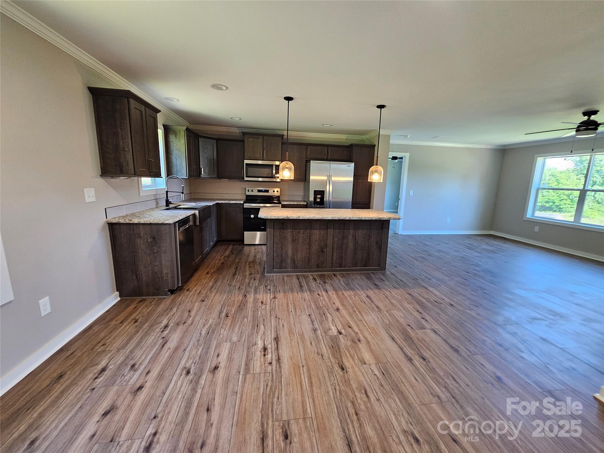 784 Severt Circle Lenoir, NC 28645 - Photo 10 of 41 a kitchen with a wooden floor and a view of kitchen